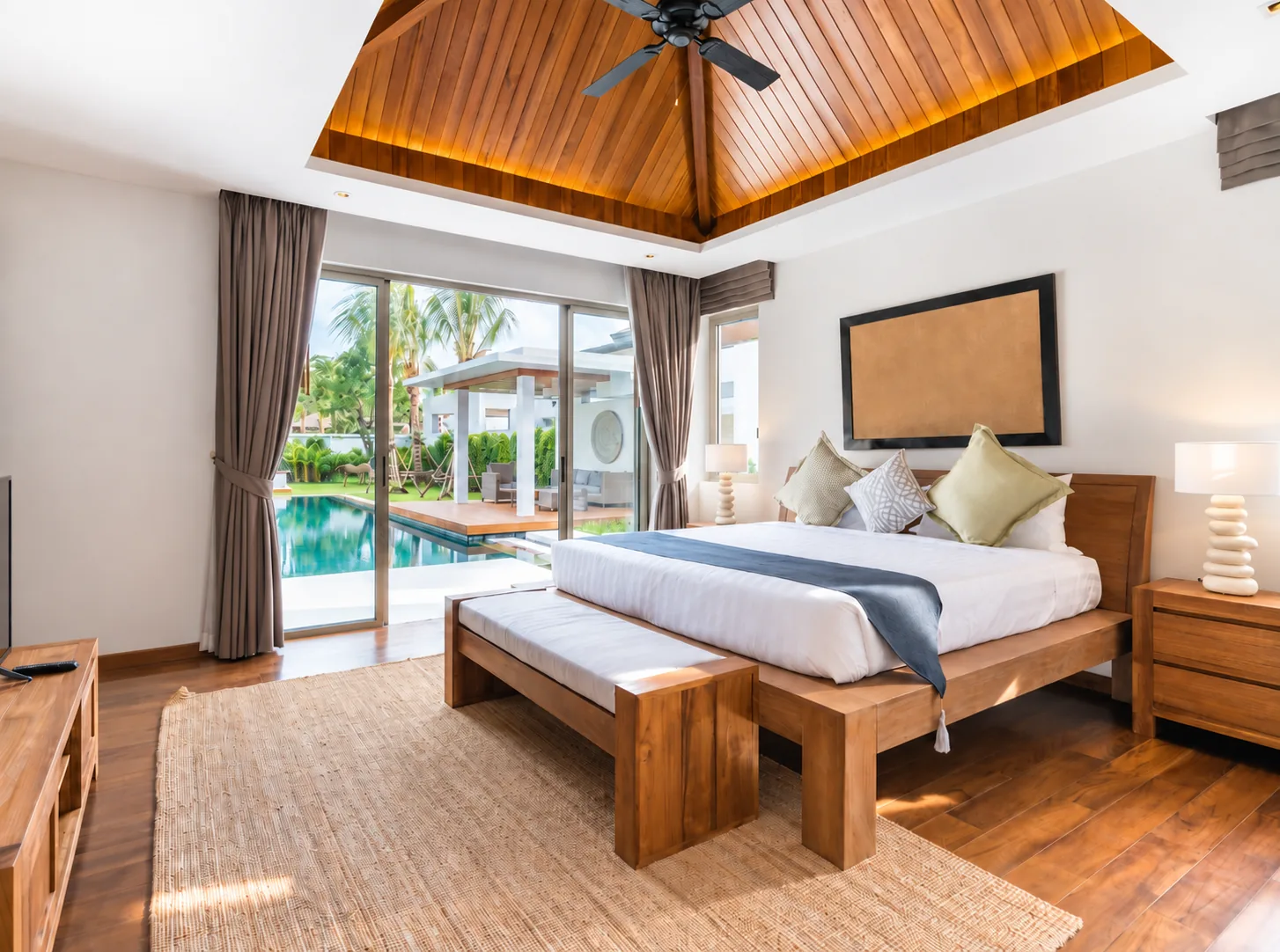 Guest-ready Airbnb bedroom with neatly made bed and warm light